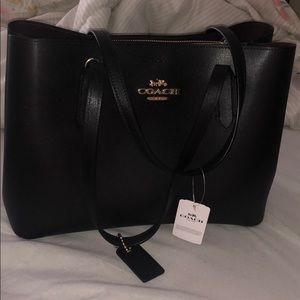 Coach purse. Black with burgundy interior